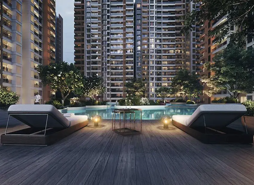 Pool deck with loungers at night